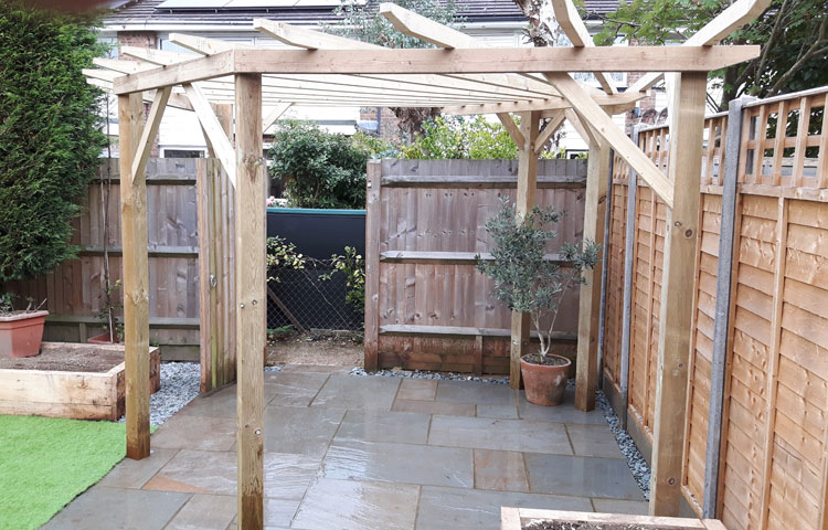  Radial pergola and Indian stone patio with planter and artificial lawn